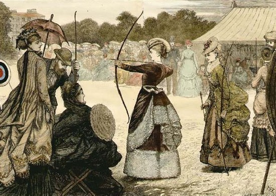 A female archer stands at the center of the frame, aiming toward a target on the left, as a crowd of onlookers watch and another archer awaits her turn.